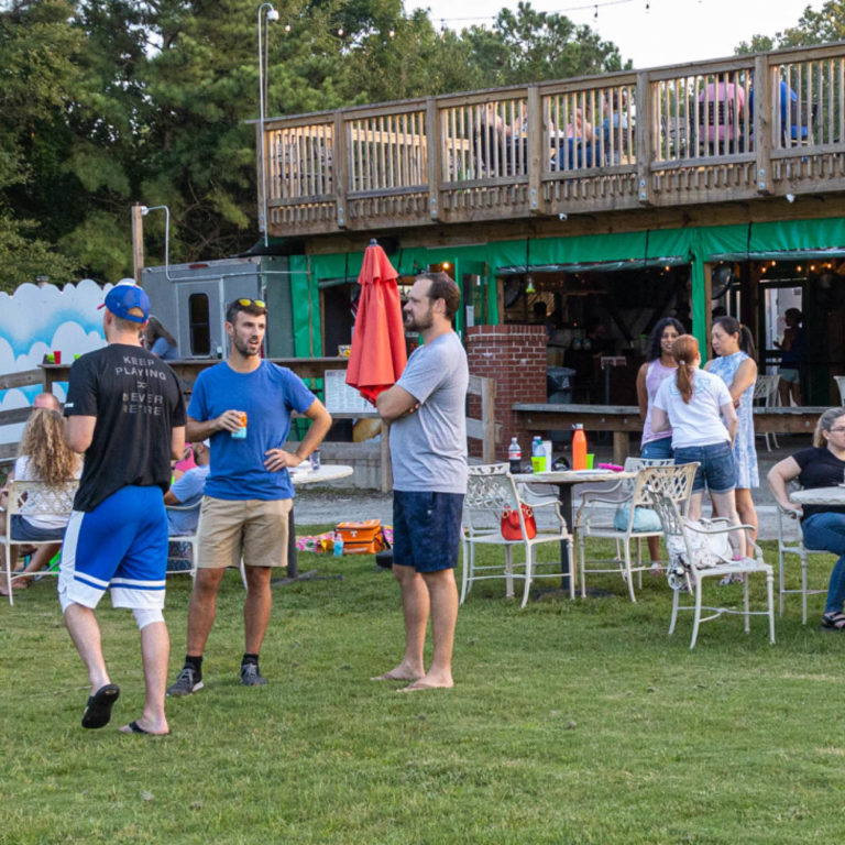 agavero outdoor seating with green grass