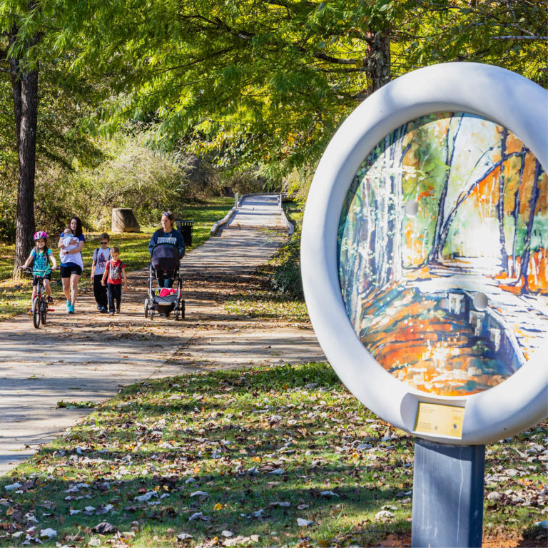 camp creek greenway walkway with art sculpture